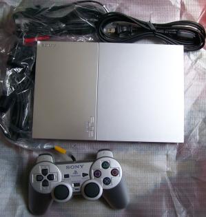 Playstation 2 silber  Zubehör  10 Spiele  1 Jahr Restgarantie
