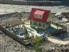 Mehrere selbstgebaute Gartenbahn häuser mit Beleuchtung ab 200 €